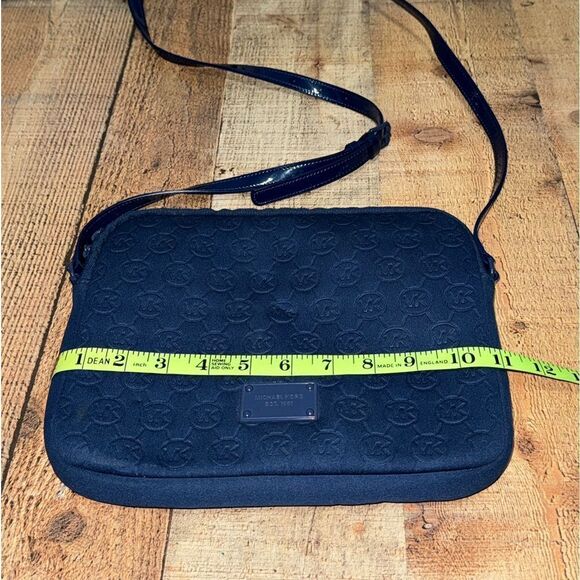 Michael Kors Mono Embossed Neoprene iPad Crossbody Purse Bag
Padded blue - Picture 13 of 16